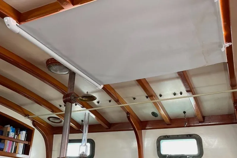 Begonia Yacht Photos Pics Interior of 1988 Custom Atkin & Lange Cutter with wooden beams and ceiling details.