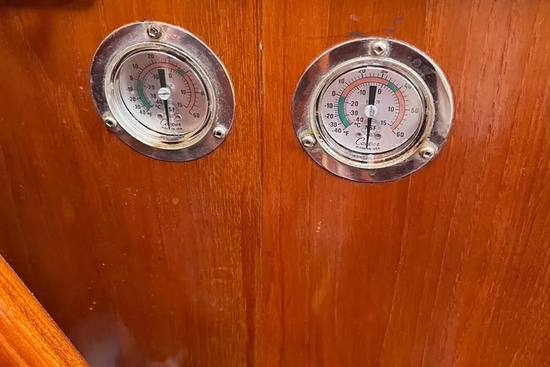 Begonia Yacht Photos Pics Wooden panel with two vintage thermometers on a 1988 Custom Atkin & Lange Cutter.