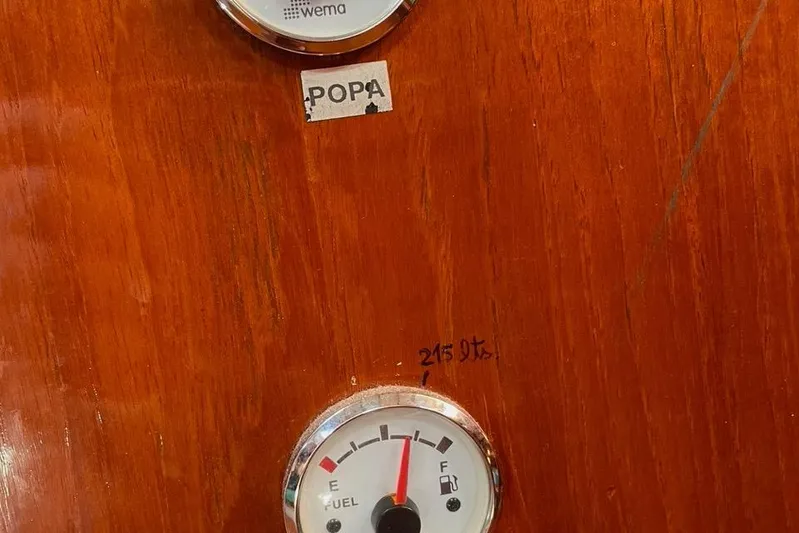 Begonia Yacht Photos Pics Fuel gauge on wooden panel of 1988 Atkin & Lange Cutter boat.