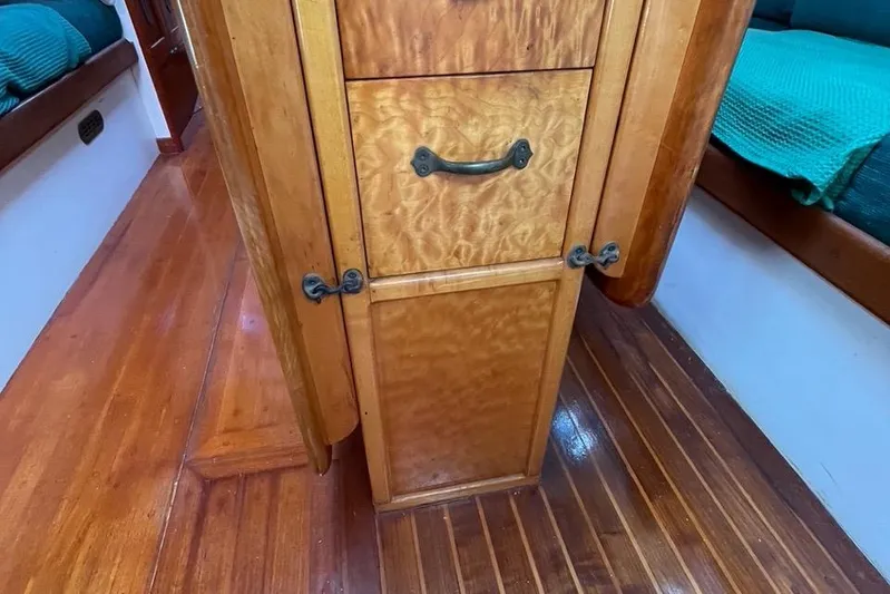 Begonia Yacht Photos Pics Wooden interior of 1988 Custom Atkin & Lange Cutter with polished cabinetry and flooring.