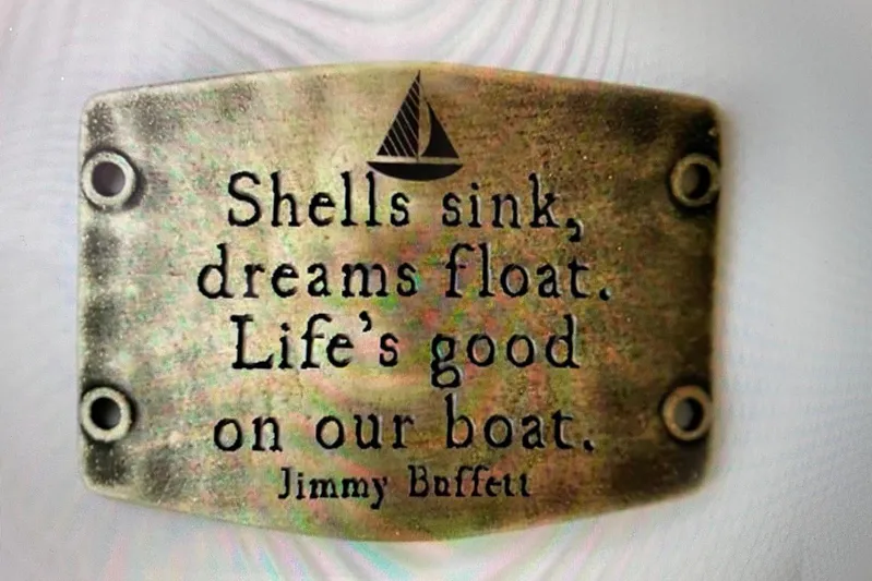 Begonia Yacht Photos Pics Engraved brass plaque with sailboat design, featuring a quote by Jimmy Buffett.