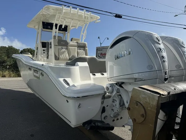  Yacht Photos Pics 2025 Key West 291 FS boat with dual Yamaha engines, parked on a trailer.