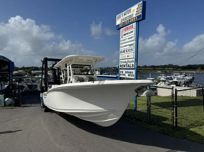  Yacht Photos Pics 2025 Key West 291 FS boat displayed at marina with rental services sign.