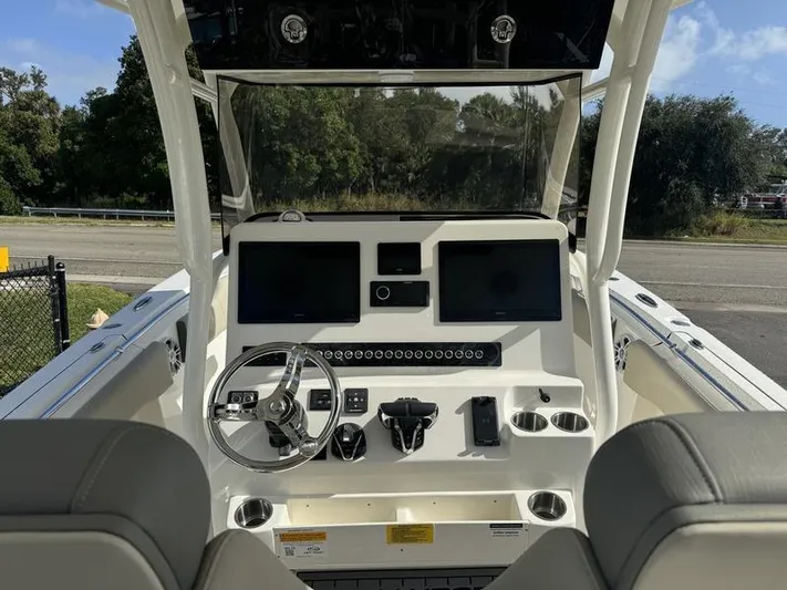  Yacht Photos Pics 2025 Key West 291 FS boat dashboard with dual screens and steering wheel.