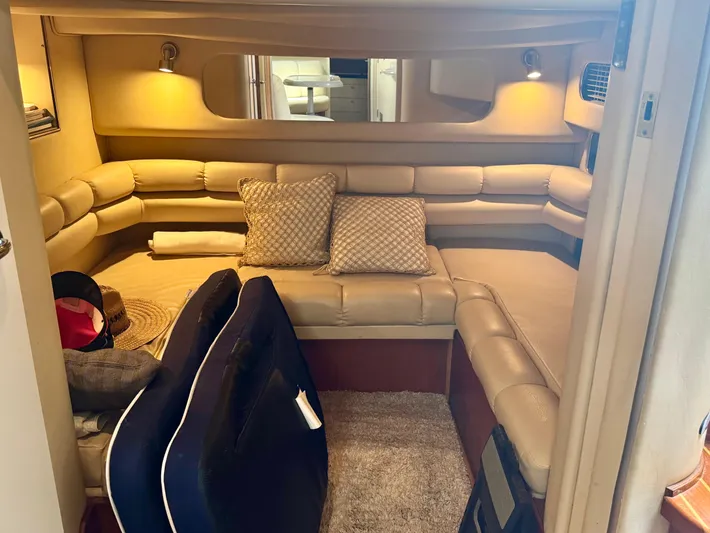 Los Sue&Ntilde;os Yacht Photos Pics Interior of 1999 Sea Ray 400 Sundancer with beige seating and cozy decor.