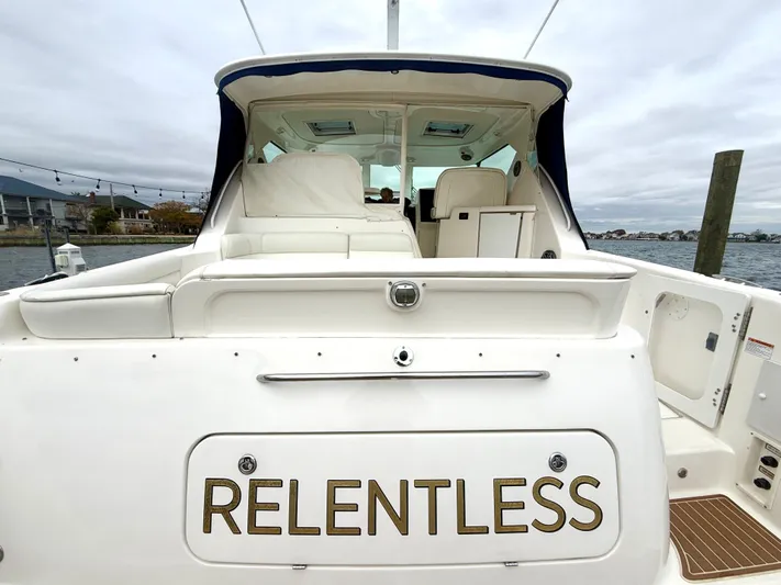 Relentless Yacht Photos Pics 2006 Tiara Yachts 4300 Sovran named "Relentless" docked by the water.