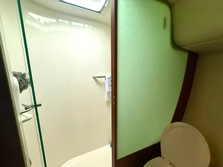 Relentless Yacht Photos Pics 2006 Tiara Yachts 4300 Sovran bathroom with toilet and shower area.