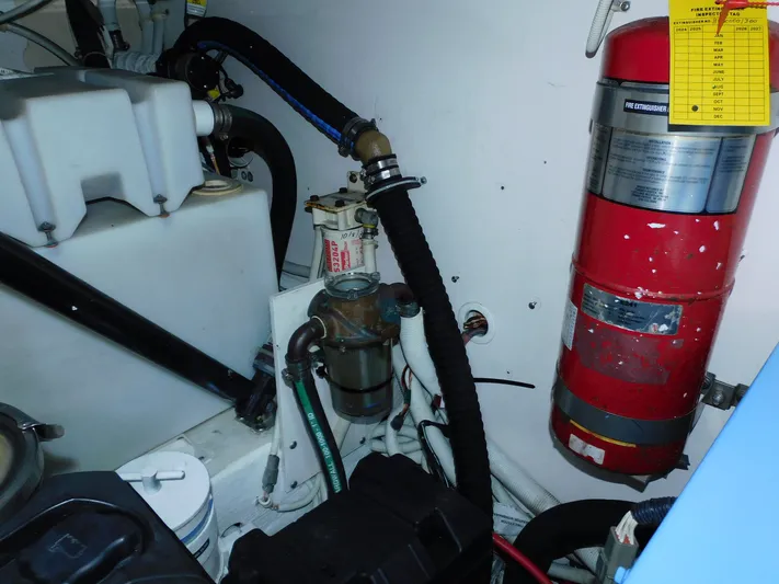Relentless Yacht Photos Pics Engine room of 2006 Tiara Yachts 4300 Sovran with fire extinguisher and equipment.