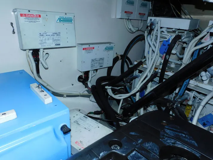 Relentless Yacht Photos Pics Engine room of 2006 Tiara Yachts 4300 Sovran, showcasing electrical systems and wiring.