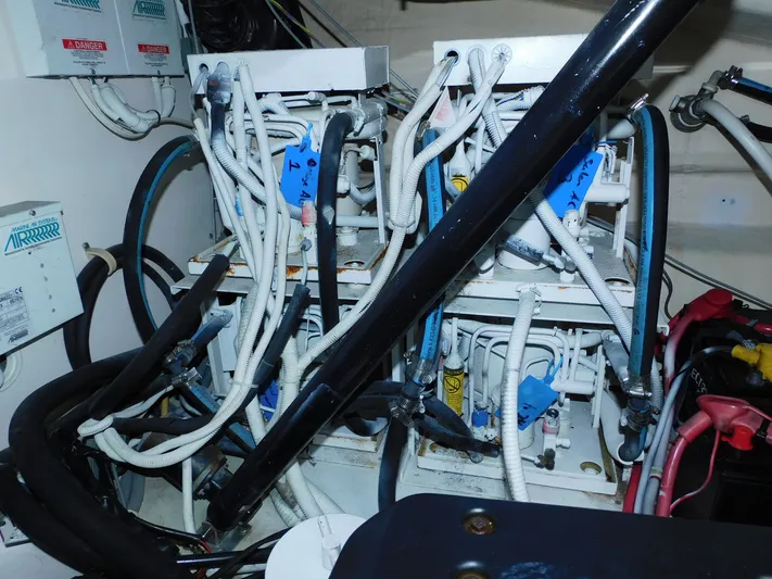 Relentless Yacht Photos Pics Engine room of 2006 Tiara Yachts 4300 Sovran with complex wiring and machinery.