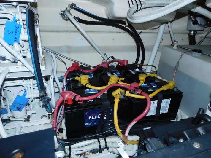 Relentless Yacht Photos Pics Battery compartment of a 2006 Tiara Yachts 4300 Sovran with cables and connections.