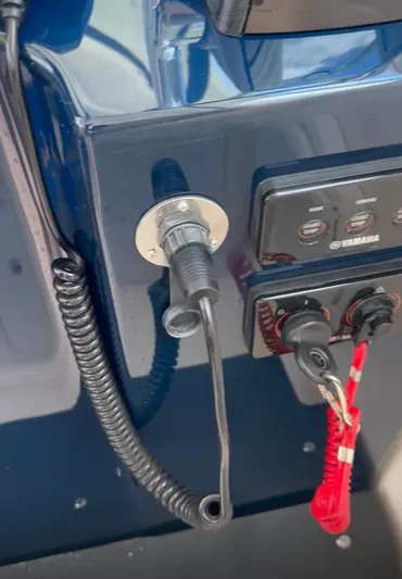  Yacht Photos Pics Control panel of a 2017 Pursuit OS 385 Offshore boat with key and switches.