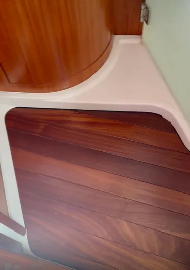  Yacht Photos Pics 2017 Pursuit OS 385 Offshore interior with wooden flooring and cabinetry detail.