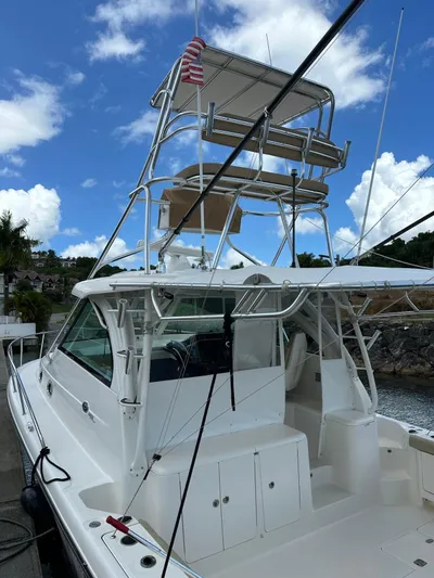  Yacht Photos Pics 2017 Pursuit OS 385 Offshore boat docked under a clear blue sky.