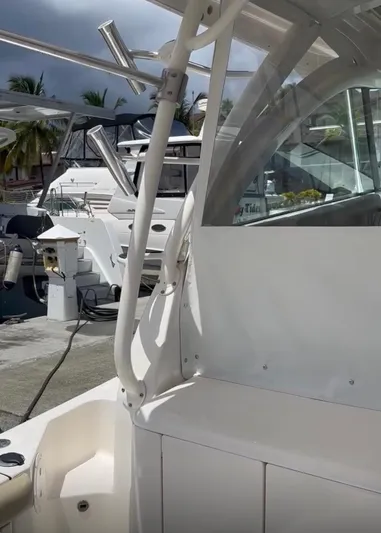  Yacht Photos Pics 2017 Pursuit OS 385 Offshore boat docked at marina with other vessels.