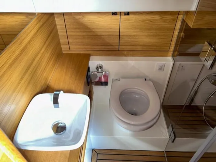  Yacht Photos Pics Modern bathroom in 2023 De Antonio Yachts D42 Open with wooden cabinetry.