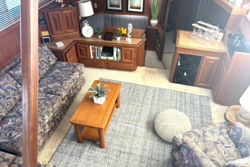  Yacht Photos Pics Cozy interior of 1987 Viking 44 Motor Yacht with plush seating and wooden furnishings.