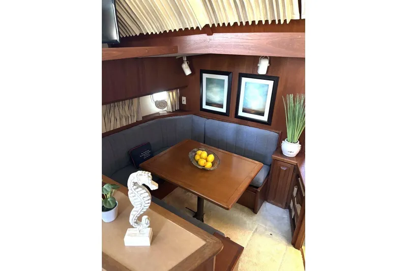  Yacht Photos Pics Cozy dining area in 1987 Viking 44 Motor Yacht with wooden table and decor.
