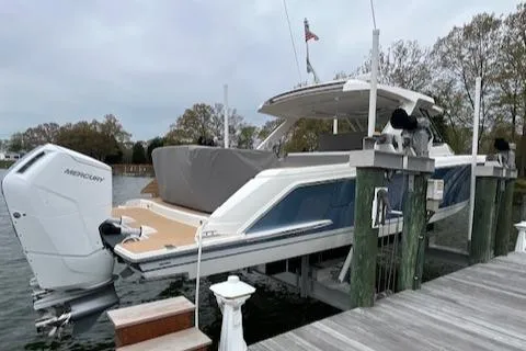  Yacht Photos Pics 2024 Tiara Yachts 43 LS docked, featuring sleek design and powerful Mercury outboard engine.