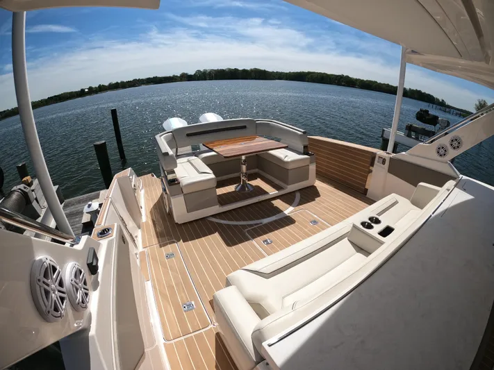  Yacht Photos Pics 2024 Tiara Yachts 43 LS luxury deck with seating, overlooking serene water.