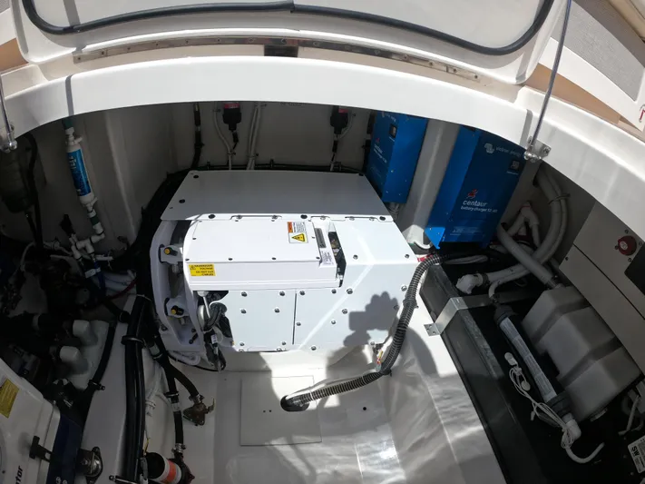  Yacht Photos Pics Engine compartment of 2024 Tiara Yachts 43 LS, showcasing mechanical components and systems.