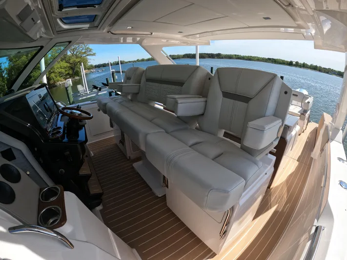  Yacht Photos Pics 2024 Tiara Yachts 43 LS interior with luxurious seating and scenic water view.