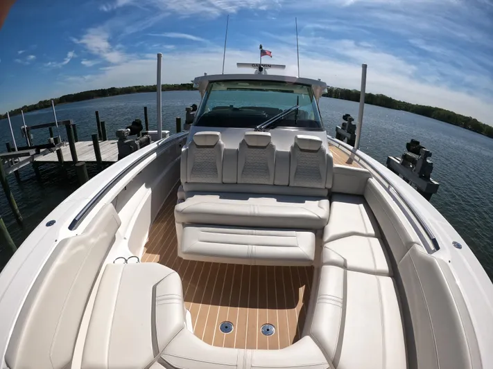  Yacht Photos Pics 2024 Tiara Yachts 43 LS luxury boat with spacious seating on a sunny day.