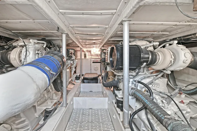 Journey Yacht Photos Pics Engine room of 2000 Torres 48 Enclosed Bridge yacht, showcasing mechanical components and systems.