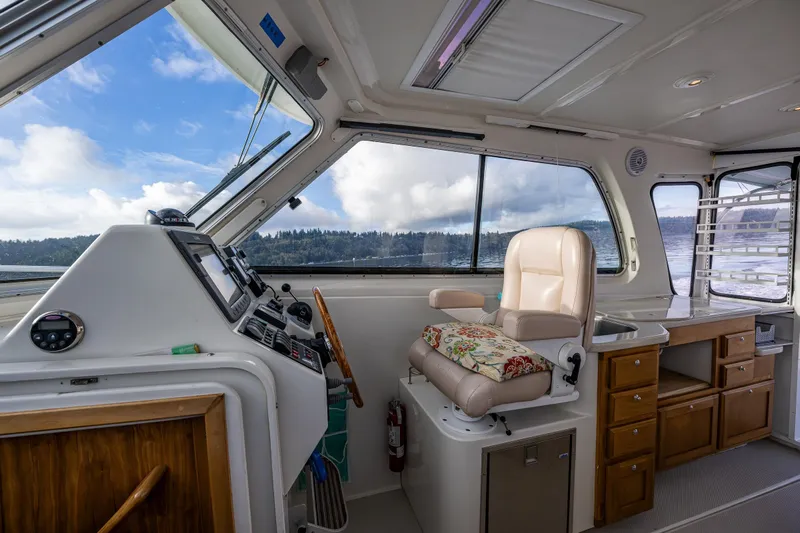 Ha Kin Yacht Photos Pics Interior of 2008 Back Cove 33 boat with helm station and comfortable seating.