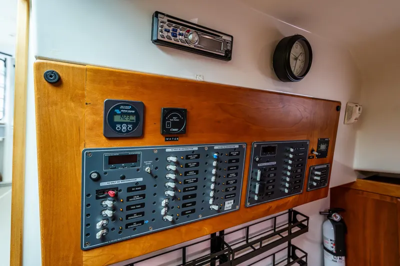 Ha Kin Yacht Photos Pics Electrical control panel in a 2008 Back Cove 33 boat, featuring switches and gauges.