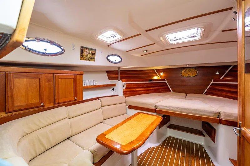 Ha Kin Yacht Photos Pics Luxurious interior of 2008 Back Cove 33 yacht with cozy seating and elegant wood finishes.