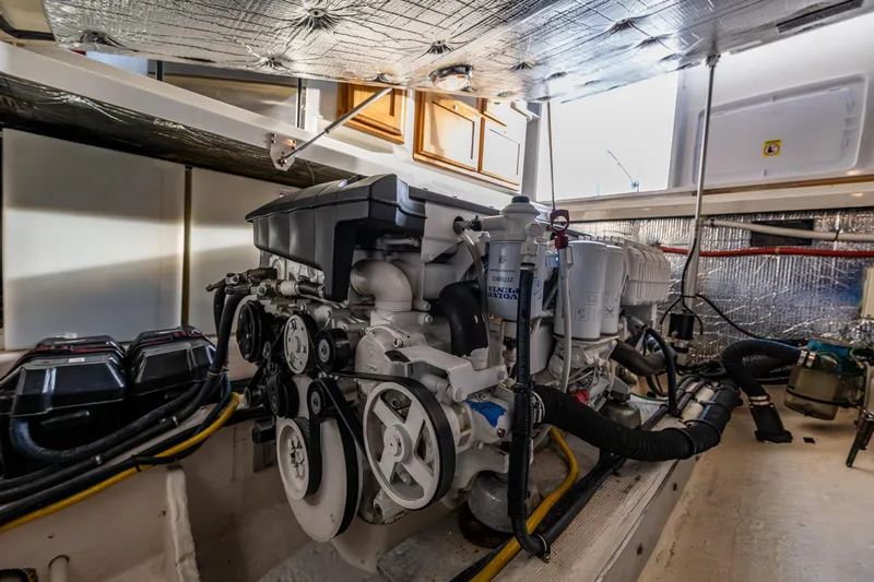 Ha Kin Yacht Photos Pics Engine room of a 2008 Back Cove 33 boat, showcasing detailed mechanical components.