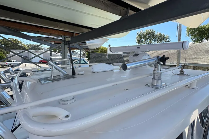  Yacht Photos Pics 2013 Pursuit OS 315 Offshore boat with radar and antenna on deck.