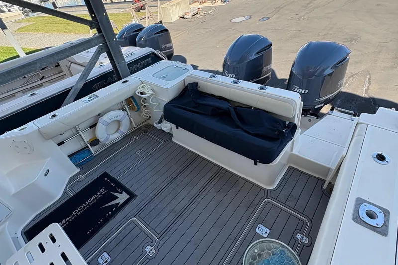  Yacht Photos Pics 2013 Pursuit OS 315 Offshore boat deck with Yamaha engines and fishing gear.