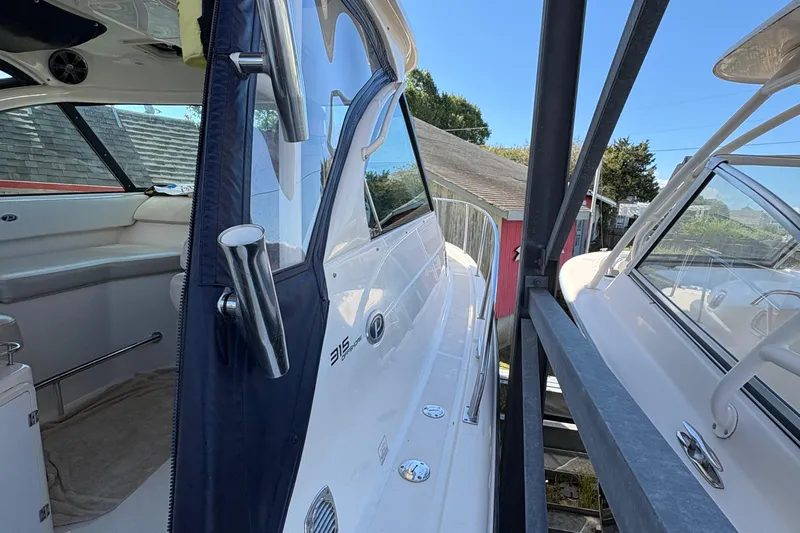  Yacht Photos Pics 2013 Pursuit OS 315 Offshore boat interior and exterior view in storage.