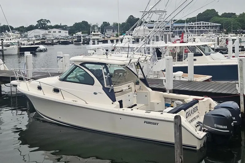  Yacht Photos Pics 2013 Pursuit OS 315 Offshore boat docked at a marina with Yamaha engines.