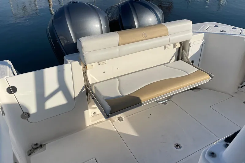  Yacht Photos Pics Edgewater 280CC 2015 boat with foldable bench seat and dual outboard motors.