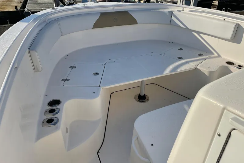  Yacht Photos Pics 2015 Edgewater 280CC boat interior with seating and cup holders.