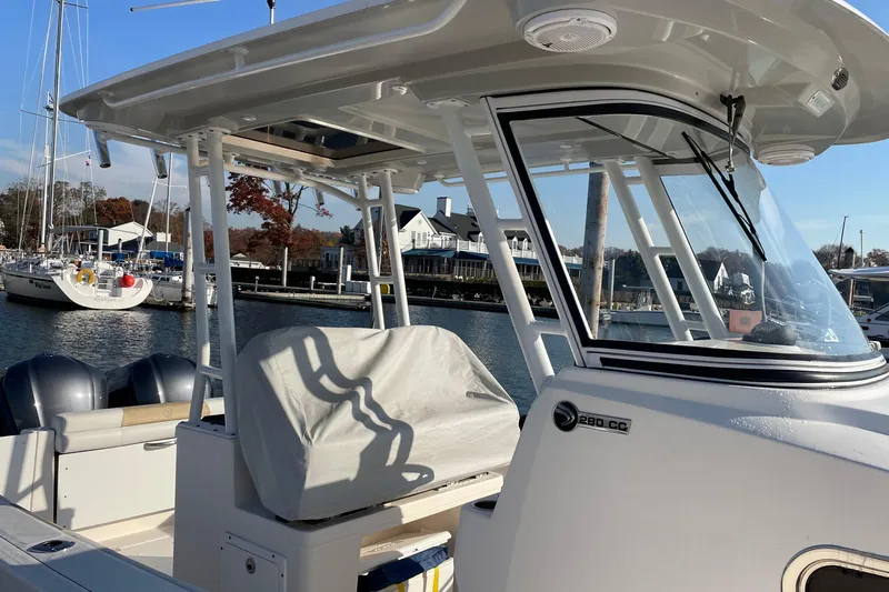  Yacht Photos Pics 2015 Edgewater 280CC boat docked at marina with clear skies.