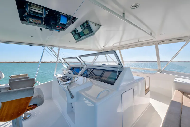  Yacht Photos Pics 2002 Viking Convertible yacht helm with modern navigation equipment and ocean view.