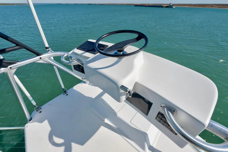 Yacht Photos Pics 2002 Viking Convertible boat helm with steering wheel on calm water.