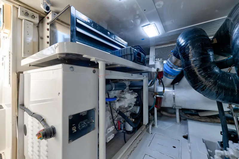  Yacht Photos Pics Engine room of a 2002 Viking Convertible yacht, featuring mechanical components and ventilation.