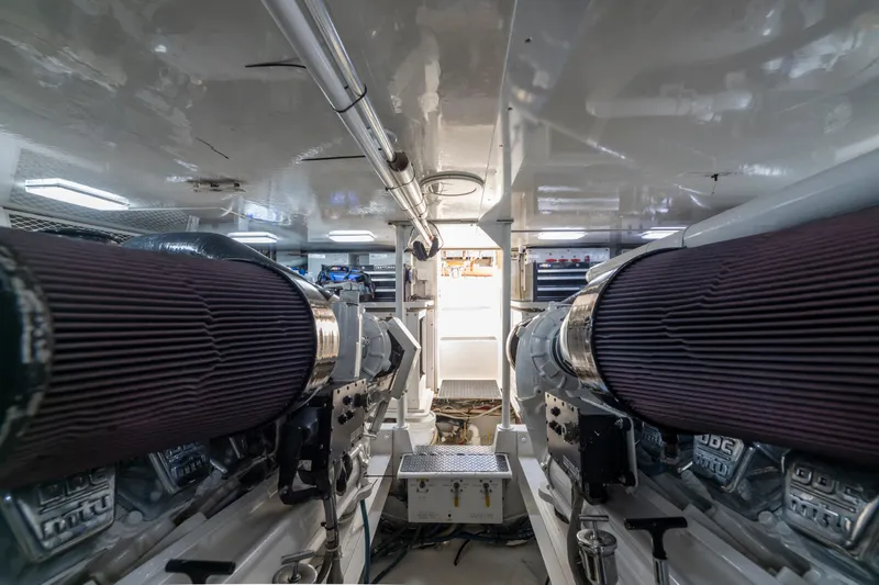  Yacht Photos Pics Engine room of a 2002 Viking Convertible yacht, showcasing dual engines and clean design.