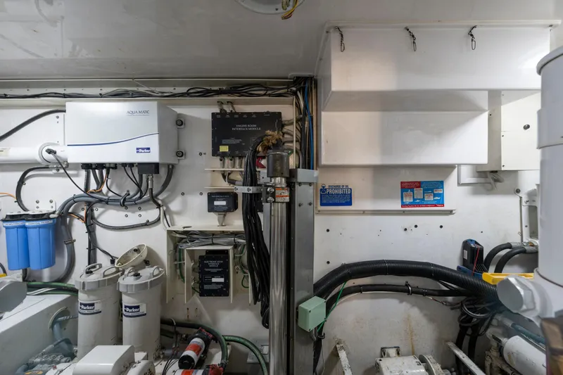  Yacht Photos Pics Engine room of a 2002 Viking Convertible boat, featuring various mechanical components and wiring.