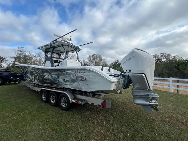  Yacht Photos Pics 2019 Yellowfin 36 Offshore boat on trailer with Mercury outboard motor.