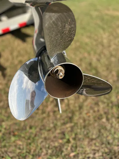  Yacht Photos Pics Close-up of a 2019 Yellowfin 36 Offshore boat propeller, reflecting sunlight.
