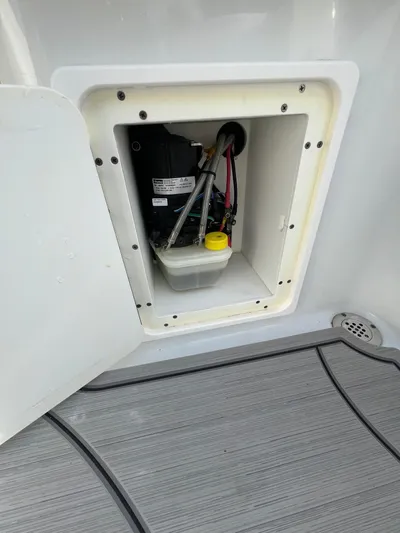  Yacht Photos Pics 2019 Yellowfin 36 Offshore boat compartment with visible wiring and components.