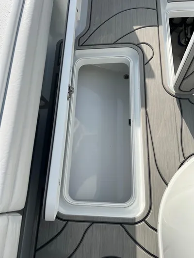  Yacht Photos Pics 2019 Yellowfin 36 Offshore boat storage compartment with open lid, showcasing interior space.