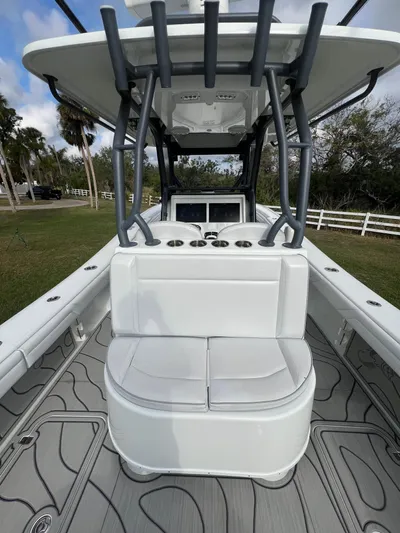  Yacht Photos Pics 2019 Yellowfin 36 Offshore boat interior with seating and console, featuring modern design elements.