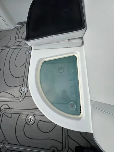  Yacht Photos Pics 2019 Yellowfin 36 Offshore boat interior with storage compartment and patterned flooring.